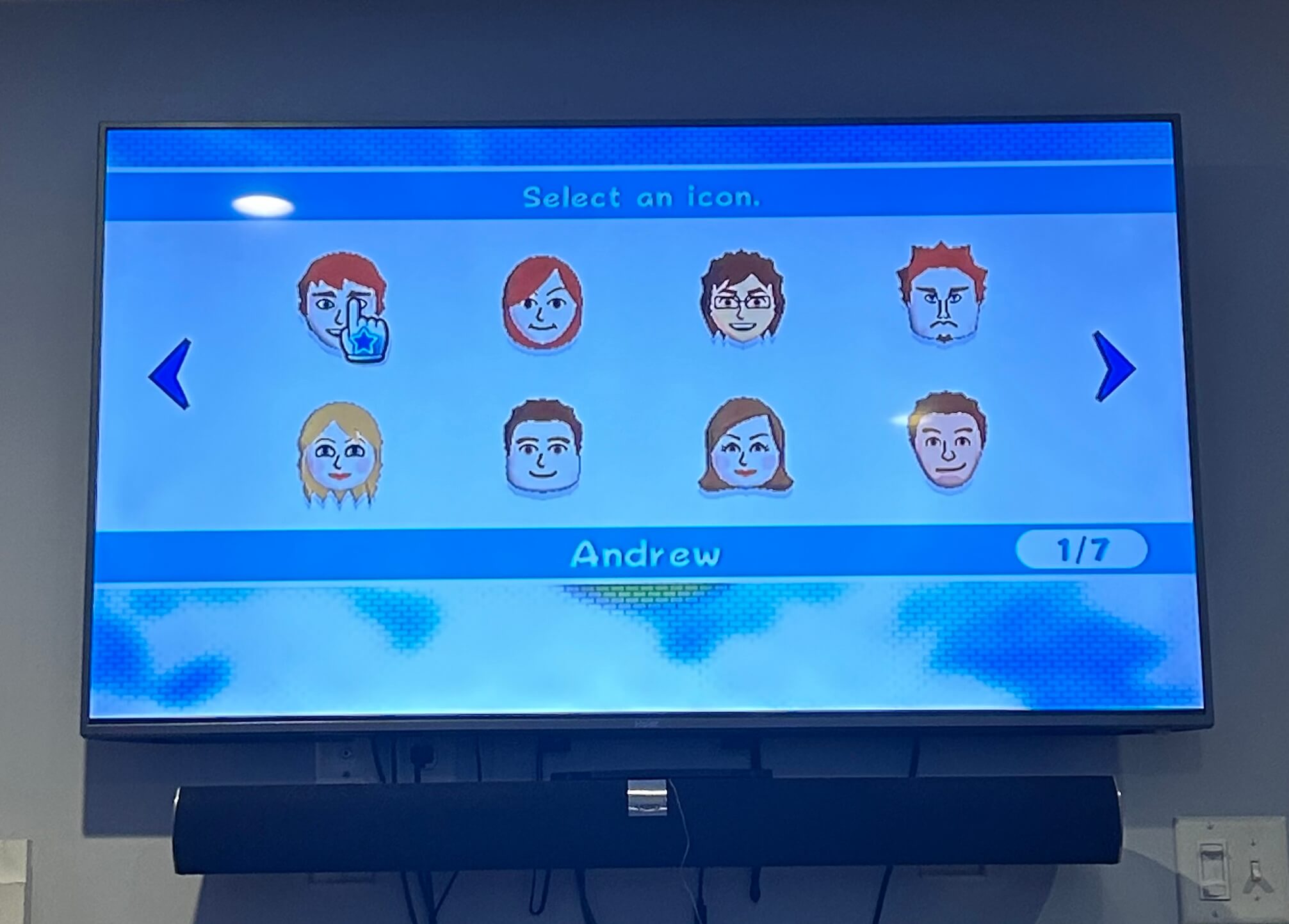 A TV displaying a variety of Mii heads from the Nintendo Wii